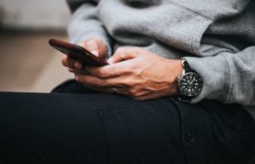 This is a photo of a person texting from the LImelight Creative Website